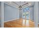 Elegant dining room with hardwood floors and French doors at 405 Chastain Rd, Seffner, FL 33584