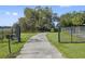 Pathway to home with black metal gates on either side at 405 Chastain Rd, Seffner, FL 33584
