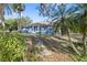 Beautiful blue house with a walkway and lush landscaping at 405 Chastain Rd, Seffner, FL 33584