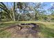 Stone fire pit in the backyard at 405 Chastain Rd, Seffner, FL 33584