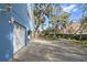 Attached garage with white door and security camera at 405 Chastain Rd, Seffner, FL 33584