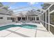 Large screened-in pool and spa, ideal for relaxation at 405 Chastain Rd, Seffner, FL 33584