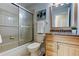Clean bathroom featuring a shower/tub combo and updated vanity at 4175 104 N Ave, Clearwater, FL 33762