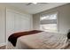 Bright bedroom with a comfortable bed and ample closet space at 4175 104 N Ave, Clearwater, FL 33762