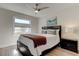 Bedroom with queen bed, ceiling fan, and hardwood floors at 4175 104 N Ave, Clearwater, FL 33762