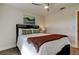 Bright bedroom with a queen-size bed and hardwood floors at 4175 104 N Ave, Clearwater, FL 33762
