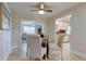 Charming dining room with glass table and four chairs, view into living room at 4175 104 N Ave, Clearwater, FL 33762
