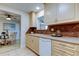 Updated kitchen with light wood cabinets and stainless steel appliances at 4175 104 N Ave, Clearwater, FL 33762