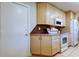 Kitchen has light wood cabinets, tile flooring, and a pantry at 4175 104 N Ave, Clearwater, FL 33762