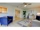 Living room showcasing a neutral color palette, comfy seating, and a view into dining area at 4175 104 N Ave, Clearwater, FL 33762