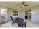 Peaceful screened patio with ceiling fan and comfortable seating at 4175 104 N Ave, Clearwater, FL 33762