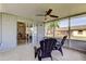 Relaxing screened patio with view of the backyard and access to the interior at 4175 104 N Ave, Clearwater, FL 33762