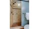 Large tiled shower with glass enclosure and handheld shower head at 4175 104 N Ave, Clearwater, FL 33762