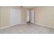 Simple bedroom with tile floors and neutral wall colors at 4651 Summerwind Dr # 26, Sarasota, FL 34234