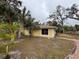 Cute yellow house with palm trees and walkway at 4651 Summerwind Dr # 26, Sarasota, FL 34234