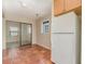 Small kitchen with wood cabinets and tile floor at 4651 Summerwind Dr # 26, Sarasota, FL 34234
