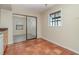 Laundry area with tile floor and access to backyard at 4651 Summerwind Dr # 26, Sarasota, FL 34234