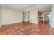 Open concept living room with kitchen and tile floors at 4651 Summerwind Dr # 26, Sarasota, FL 34234