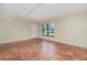 Bright living room with tile floors and a door to the outside at 4651 Summerwind Dr # 26, Sarasota, FL 34234