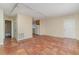 Open living area with tile floors and kitchen access at 4651 Summerwind Dr # 26, Sarasota, FL 34234