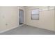 Storage or utility room with tile floor and window at 4651 Summerwind Dr # 26, Sarasota, FL 34234