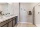 Double vanity bathroom with shower and modern finishes at 5247 Salt Marsh Rd, Wimauma, FL 33598