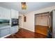 Gray cabinets, black appliances, and wood floors in kitchen at 5312 17Th S Ave, Gulfport, FL 33707