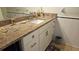 Clean bathroom with granite countertop and white cabinets at 5975 Terrace Park N Dr # 102, St Petersburg, FL 33709