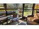 Enclosed patio with wicker furniture and table at 5975 Terrace Park N Dr # 102, St Petersburg, FL 33709