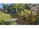 Landscaped grounds with lush tropical plants at 5975 Terrace Park N Dr # 102, St Petersburg, FL 33709