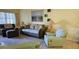 Bright living room featuring comfy seating and a large artwork at 5975 Terrace Park N Dr # 102, St Petersburg, FL 33709
