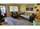 Living room with brown leather chair and coastal decor at 5975 Terrace Park N Dr # 102, St Petersburg, FL 33709