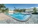Inviting community pool with plenty of space for relaxation at 5975 Terrace Park N Dr # 102, St Petersburg, FL 33709