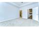 Spacious bedroom with carpet flooring and access to the bathroom and kitchen at 6112 Plover Meadow St, Lithia, FL 33547
