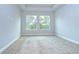 Large bedroom with neutral walls, plush carpeting and double windows at 6112 Plover Meadow St, Lithia, FL 33547