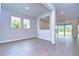 Open concept dining area with tile floors and access to the kitchen at 6112 Plover Meadow St, Lithia, FL 33547