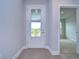 Bright and airy entryway with white door and view to the backyard at 6112 Plover Meadow St, Lithia, FL 33547