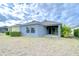 House exterior showcasing a well-maintained lawn and patio at 6112 Plover Meadow St, Lithia, FL 33547