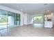 Spacious living area with tile floors and views of the backyard at 6112 Plover Meadow St, Lithia, FL 33547