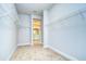 Spacious walk-in closet with wire shelving and plush carpeting at 6112 Plover Meadow St, Lithia, FL 33547