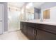 Modern bathroom with double vanity and glass shower at 6206 Windship Ct, Tampa, FL 33647