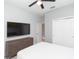 Bedroom with TV, dresser, and double doors to closet at 6206 Windship Ct, Tampa, FL 33647