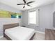 Bedroom with ceiling fan and modern decor at 6206 Windship Ct, Tampa, FL 33647