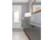 Modern entryway with gray console table and mirror at 6206 Windship Ct, Tampa, FL 33647
