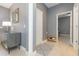 Gray hallway with shoe rack and view into another room at 6206 Windship Ct, Tampa, FL 33647