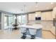 Modern kitchen with white cabinets, quartz countertops, and stainless steel appliances at 6206 Windship Ct, Tampa, FL 33647