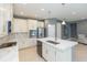 Modern kitchen with white cabinets and a large island at 6206 Windship Ct, Tampa, FL 33647