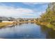 Tranquil lake view with houses lining the shore at 6206 Windship Ct, Tampa, FL 33647