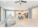 Open living room and kitchen area with grey walls and modern decor at 6206 Windship Ct, Tampa, FL 33647