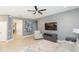 Spacious living room with light grey walls and a ceiling fan at 6206 Windship Ct, Tampa, FL 33647